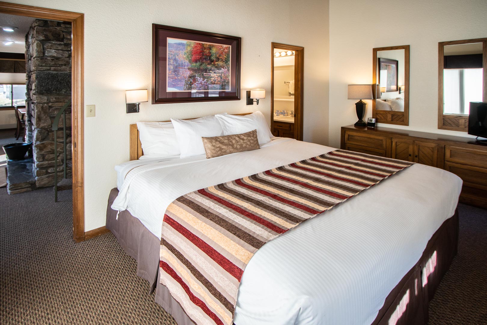 A spacious master bedroom at VRI's Mountain Loft Resort in North Carolina.